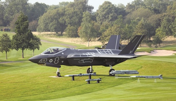 A model of an F-35 Lightning II joint strike fighter jet, produced by Lockheed Martin Corp, stands on display at the Celtic Manor resort in Newport, the UK. Lockheed is planning to build more than 3,000 of the $379bn F-35 Joint Strike Fighter for the US and allied forces, a project that will create tens of thousands of jobs at factories across the country and overseas.