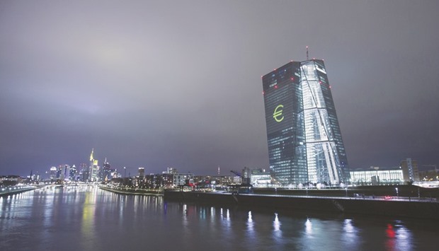 An illuminated euro currency symbol is projected on to the ECB headquarters in Frankfurt. In the ECB stress test, Deutsche Bank emerged with a CET1 ratio of 7.8%, while UniCredit had 7.1%. The CET1 ratios of Barclays and Societe Generale were 7.3% and 7.5%, respectively.