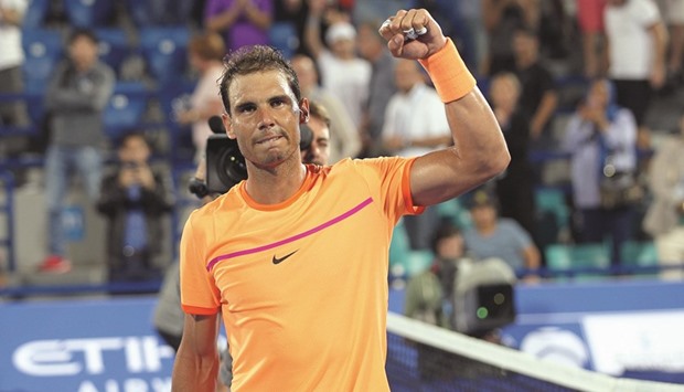 Rafael Nadal gestures after defeating Canadau2019s Milos Raonic during their semi-final in the Mubadala World Tennis Championship.