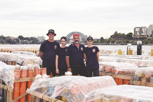 Sydneyu2019s New Yearu2019s Eve fireworks director Fortunato Foti (second right) posing with his children Elena (second left), Angelina (right) and Salvatore in front of the Harbour Bridge in Sydney.