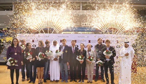 Winners of the Fide World Rapid and Blitz Championship with Qatar Chess Association (QCA) president Khalifa al-Hitmi, Fide president Kirsan Ilyumzhinov and QCA general secretary Mohamed al-Medaihki at Ali Bin Hamad Al Attiyah Arena yesterday. PICTURES: Shemeer Rasheed
