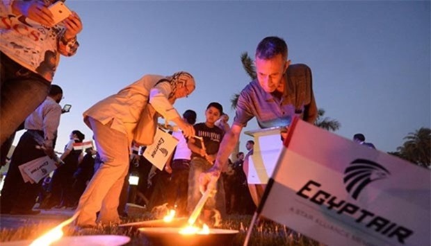 Egyptians light candles during a candlelight vigil for the 66 victims of the EgyptAir MS804 flight that crashed in the Mediterranean Sea