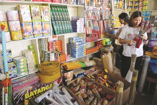 Firecrackers for sale are pictured in a store during New Yearu2019s Eve in Bocaue, Bulacan province, north of Manila, yesterday.