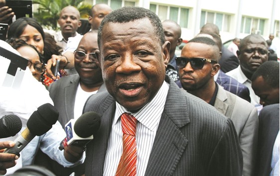 Congolese Government spokesman Lambert Mende addresses the media during talks between the opposition and the government of President Joseph Kabila outside the Conference episcopale nationale du Congo (CENCO) headquarters in Kinshasa yesterday.
