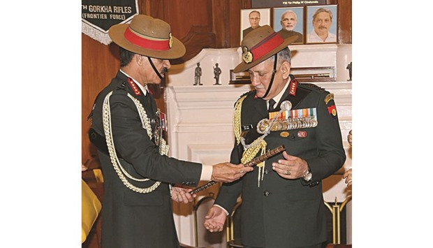 General Dalbir Singh hands over the baton to General Bipin Rawat in the office of Chief of Army Staff in New Delhi yesterday.