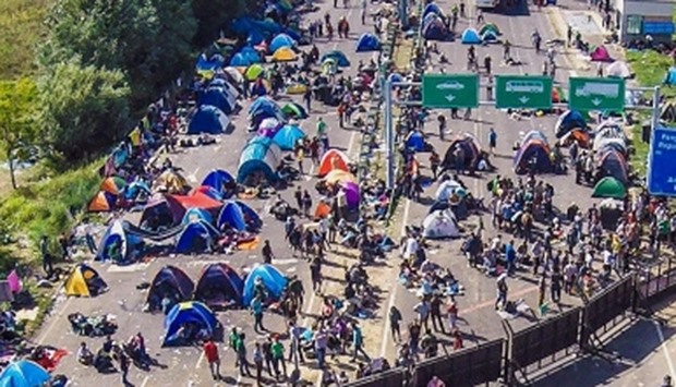 an aerial view of migrants camping