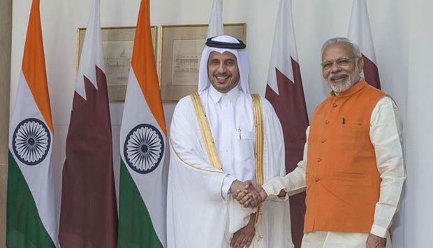HE the Prime Minister and Minister of Interior Sheikh Abdullah bin Nasser bin Khalifa al-Thani shakes hands with India's Prime Minister Narendra Modi prior to a meeting in New Delhi