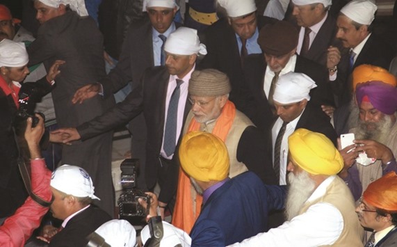 Prime Minister Narendra Modi and Afghanistan President Ashraf Ghani visit the Golden Temple in Amritsar yesterday.