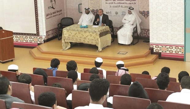 QIB Group CEO Bassel Gamal delivers a lecture at the Ahmad bin Hanbal Independent Boys School.