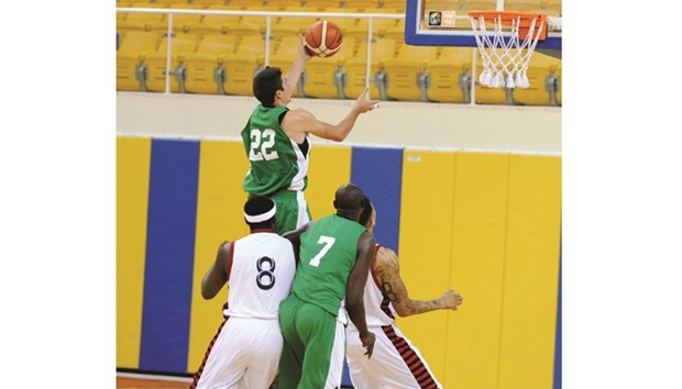 Action from the Al Rayyan-Al Ahli match in the Qatar Basketball League yesterday.