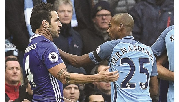 Manchester Cityu2019s Brazilian midfielder Fernandinho (right) was sent off and faces a three-game ban for throttling Chelseau2019s Cesc Fabregas and shoving him over an advertising hoarding during their ill-tempered Premier League clash at the Etihad Stadium in Manchester yesterday. City striker Sergio Aguero was earlier sent off for a flying lunge on David Luiz and faces a four-match suspension. Chelsea won 3-1, the Premier League leadersu2019 eighth victory in succession u2014 their best such run within the same season since 2007 u2014 and leaves them four points clear of City at the top of the table. (AFP)