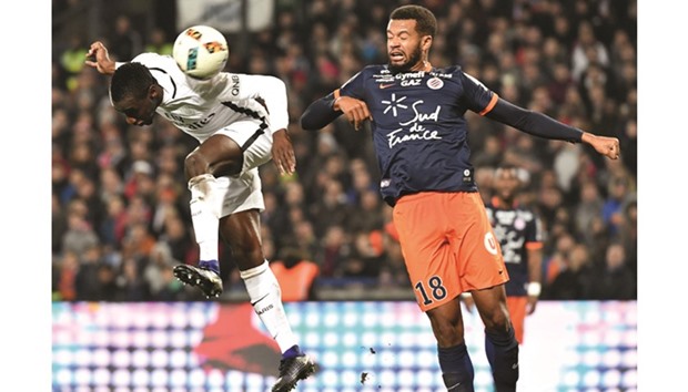 Paris Saint-Germainu2019s French midfielder Blaise Matuidi (left) vies for the ball with Montpellieru2019s French defender Nicolas Saint-Ruf during the French Ligue 1 match at the La Mosson Stadium in Montpellier, southern France, yesterday. (AFP)