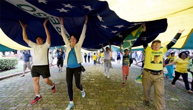 People attend a protest against corruption at the Liberdade square in Belo Horizonte, Brazil on Sunday.