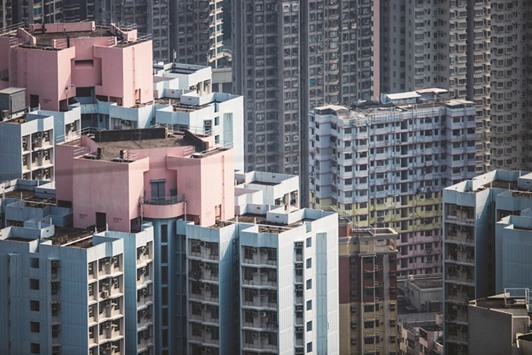 Residential buildings are seen in Hong Kong. The property market in Hong Kong, after weathering dramatic boom and bust cycles over the past two decades, is poised for a leg down as higher borrowing costs and additional levies deflate buyer demand.