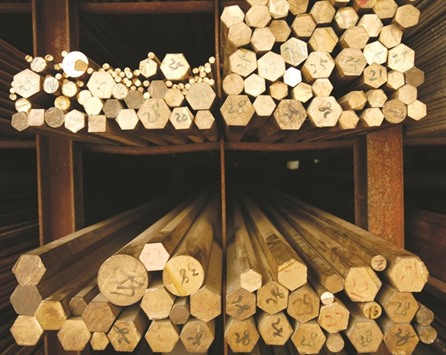 Copper rods are organised on a rack at a hardware store in Shanghai. The worldu2019s biggest consumer is making more copper domestically than ever before, using supplies of foreign ore concentrate, which is curbing demand for the refined metal.