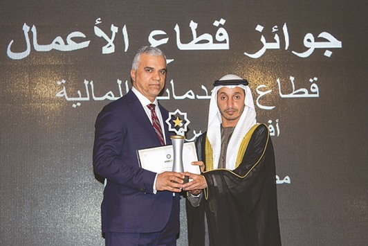 A Masraf Al Rayan executive receiving the u201cBest Arab Bank Award 2016u201d in Marrakech, Morocco.