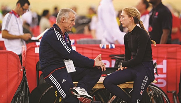 A file picture of four-times Olympic champion Laura Kenny (R) with former British cycling technical director Shane Sutton.