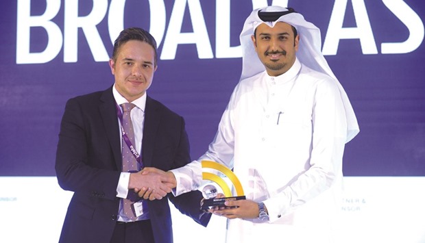 Faisal al-Raisi, right, receiving the award.