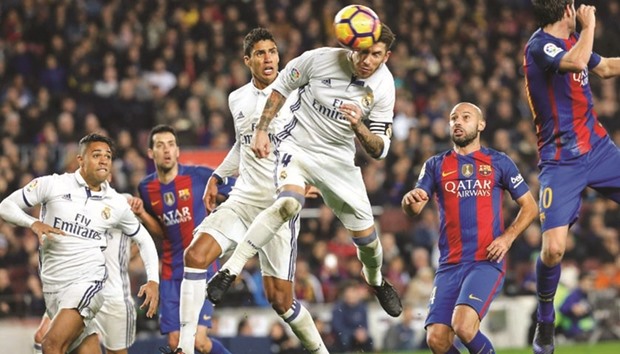 Sergio Ramosu2019s stoppage time equaliser salvaged a point for Real Madrid in a 1-1 draw at Barcelona in El Clasico on Saturday. (AFP)