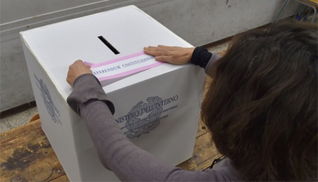 A polling station officer prepares ballots on the eve of a crucial referendum
