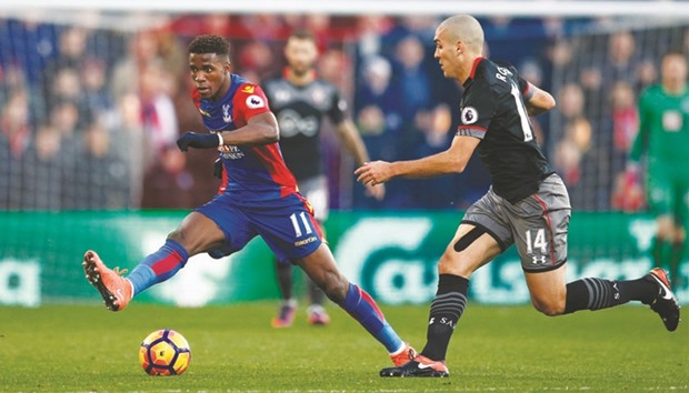 Crystal Palaceu2019s Wilfried Zaha (left) in action with Southamptonu2019s Oriol Romeu during their English Premier League match at Selhurst Park on Saturday. (Reuters)