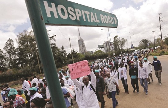 Kenyan medical staff march in Nairobi during a strike to demand fulfilment of a 2013 agreement between their union and the government.