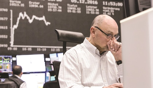 A trader monitors financial data inside the Frankfurt Stock Exchange yesterday. The DAX jumped 1.6% yesterday to 10,684.83 points.