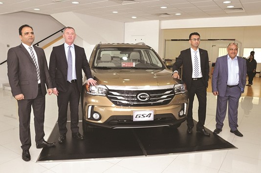 Domasco officials flank the new GS4 at its launch yesterday.