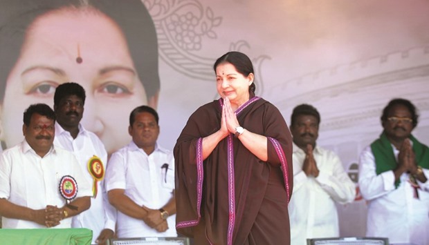 This file photo taken on March 27, 2014 shows Jayalalithaa gesturing as she arrives at a public meeting in Puducherry. The charismatic chief minister of Tamil Nadu died after a prolonged illness yesterday.