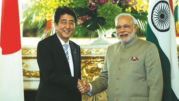 Indian Prime Minister Narendra Modi shakes hands with Japanese Prime Minister Shinzo Abe in Tokyo (file). A personal rapport between the two leaders led to a u00a550bn Japanese loan for improving infrastructure in India apart from the investment pledge.