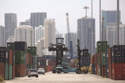 A truck moves a container in the Port of Miami. The US trade gap widened 17.8% to $42.6bn in October, the Commerce Department said yesterday.