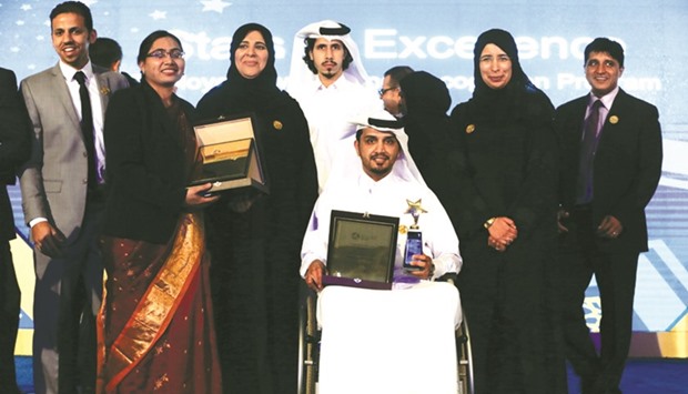 HE Dr Hanan Mohamed al-Kuwari and members of  the winning team at the HMC Stars of Excellence Awards.