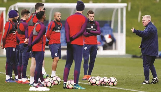 Assistant manager Sammy Lee (right) pictured talking to England players during a training session in November. (Reuters)