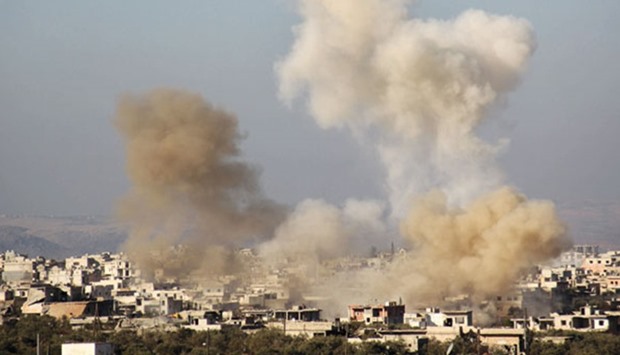 A picture taken from a rebel-held area shows smoke billowing from buildings in the pro-regime Shia town of Fuaa, in northwestern Idlib province in Syria yesterday. Syriau2019s government said it would not agree to a ceasefire in Aleppo unless it guarantees a full withdrawal of rebel factions from the city.