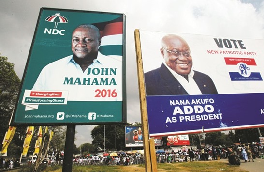 Campaign billboards show Mahama and Akufo Addo on a street in Accra.