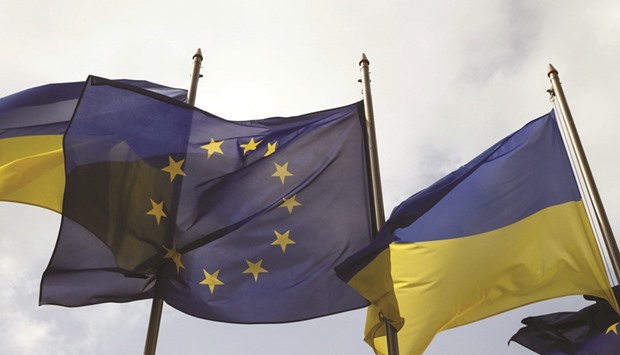 Ukrainian and EU flags fly in front of the presidential administration in Kiev.