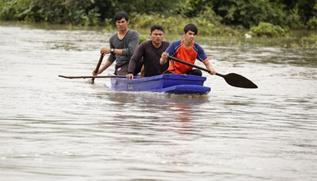 Rescue workers search for two missing boys who went missing during a flash flood