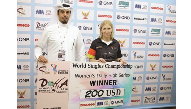 As the leader of first block, Germanyu2019s Birgit Poppler (right) received a bonus from Qatar Bowling Federation on Monday.