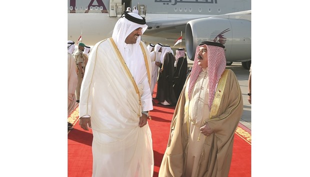 HH the Emir Sheikh Tamim bin Hamad al-Thani is being greeted by King Hamad bin Isa al-Khalifah of Bahrain on arrival in Manama yesterday.