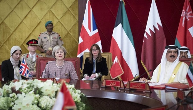 Britain's Prime Minister Theresa May attends a working session of the Gulf Cooperation Council meeting with the King of Bahrain King Hamad Bin Isa Khalifa in Manama, Bahrain