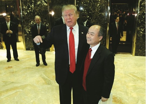 US President-elect Donald Trump and SoftBank CEO Masayoshi Son speak to the press after meeting at Trump Tower in Manhattan, New York City. The Japanese firm reaped huge profits from a partial sale of its stake in Alibaba, while in June it sold Finnish game-maker Supercell Oy to Chinese Internet giant Tencent for $8.6bn.
