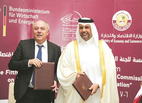 HE Sheikh Ahmed and Machnig pose after signing the minutes of the meeting of the Qatari-German Joint Commission on the sidelines of the u2018Qatari-German Business Forumu2019 organised yesterday by the Qatar Businessmen Association in cooperation with the MEC and the German Industry and Commerce Office. PICTURE: Jayaram