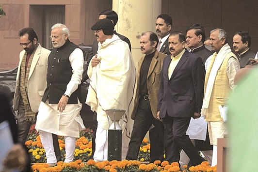 Prime Minister Narendra Modi is accompanied by Minister of State for Parliamentary Affairs Mukhtar Abbas Naqvi as he comes out after a BJP Parliamentary Party meeting yesterday.