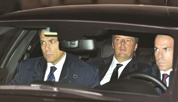 Prime Minister Matteo Renzi, centre, arrives at the Quirinale Presidential Palace yesterday in Rome, to present his official resignation to President Sergio Mattarella.