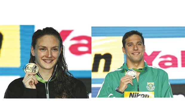 Katinka Hosszu poses with her gold medal from the 400m Individual Medley final on day one of the 13th FINA World Swimming Championships (25m) at the WFCU Centre in Windsor Ontario, Canada.   Right photo: Chad Le Clos of South Africa poses with 200m butterfly gold medal on day one of the 13th FINA World Swimming Championships at the WFCU Centre in Windsor Ontario, Canada. (Getty Images/AFP)