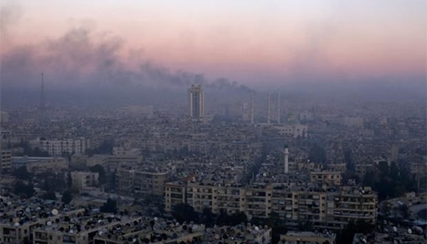Smoke rises near the Old City of Aleppo as seen from a government controlled area of the city on Thursday.