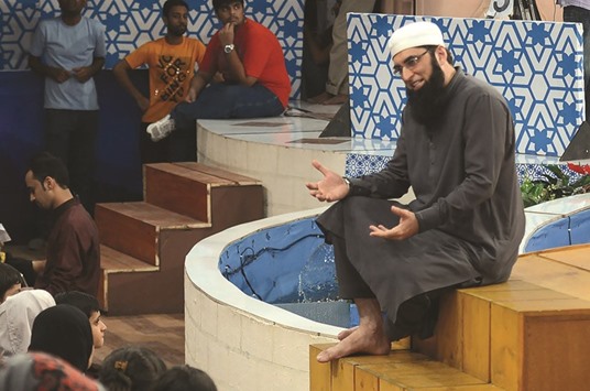 In this photograph taken on August 1, 2013, Pakistani television show host Junaid Jamshed  presents an Islamic quiz show Shan-e-Ramadan in Karachi.