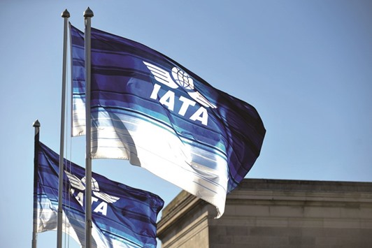 Flags with IATA logo fly above the venue of their symposium in Dublin (file). Next year IATA expects air travel to be growing close to its 20-year trend. Falling travel costs have been adding several percentage points to RPK (revenue tonne kilometres)  growth over the several years.