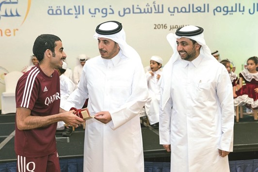 HE the Prime Minister and Minister of Interior Sheikh Abdullah bin Nasser bin Khalifa al-Thani honouring a Qatari Paralympian on the occasion.