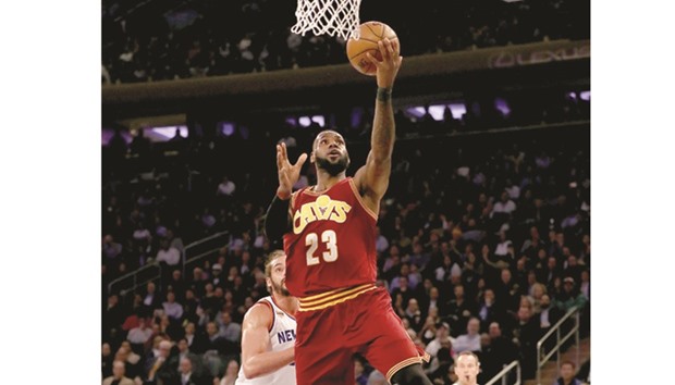 LeBron James (right) of the Cleveland Cavaliers heads for the net during the game against NY Knicks at Madison Square Garden in New York City on Wednesday. (AFP)